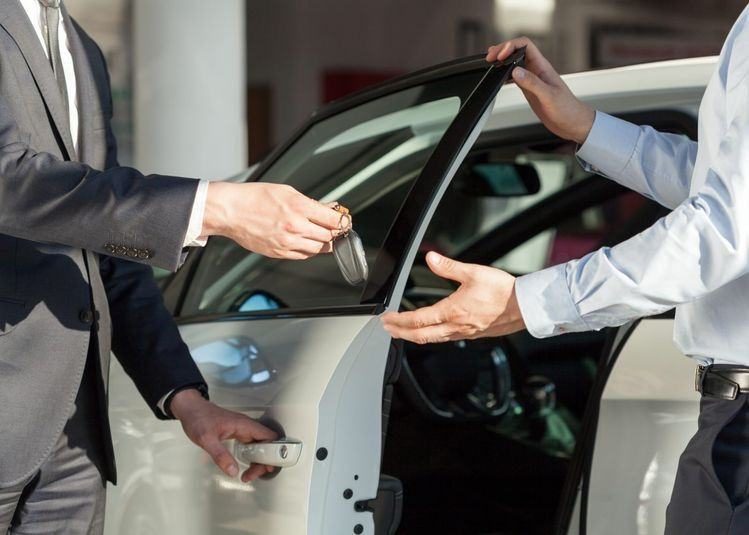 Customer receiving car keys after service